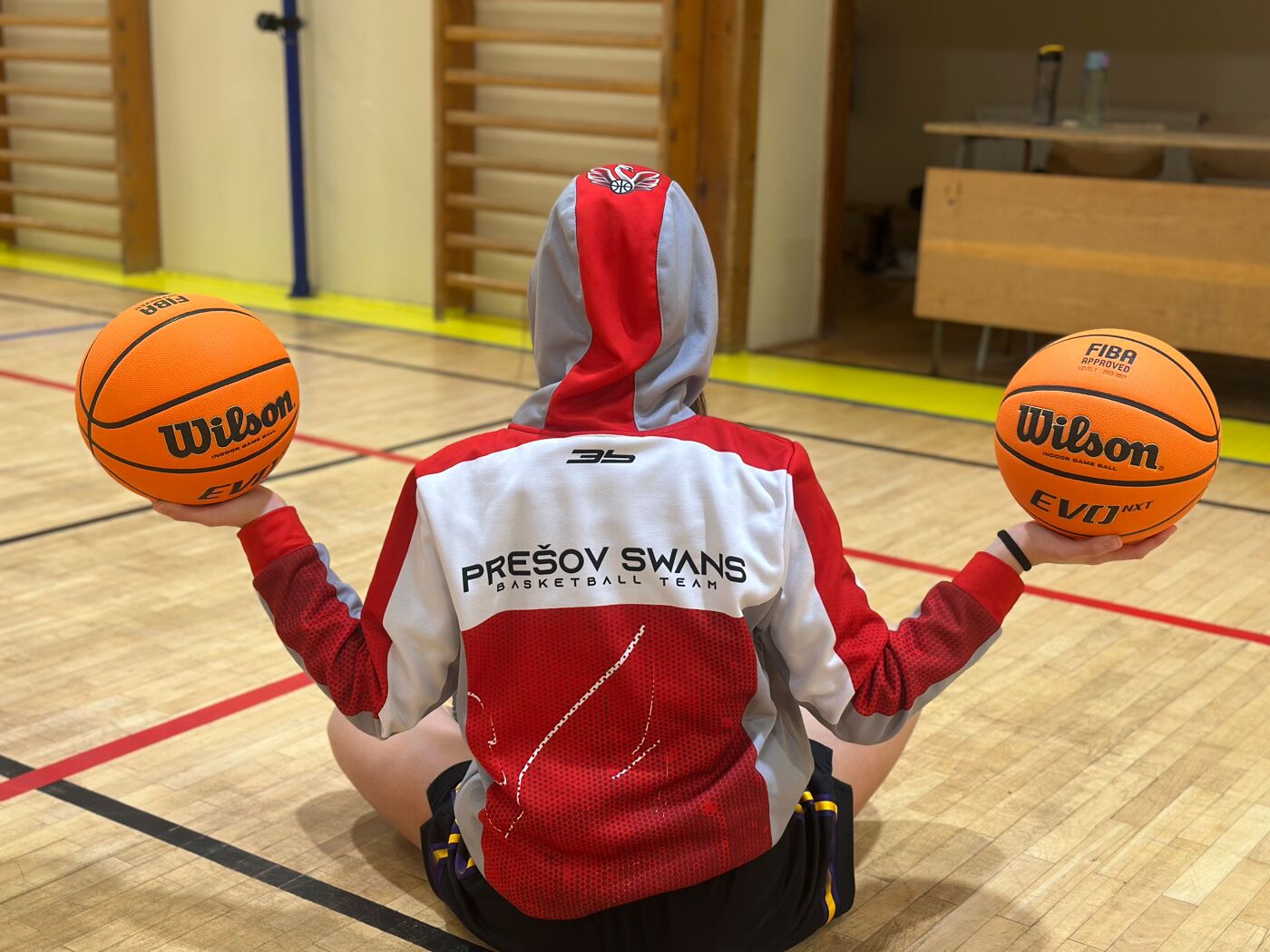 Girls practicing basketball drills